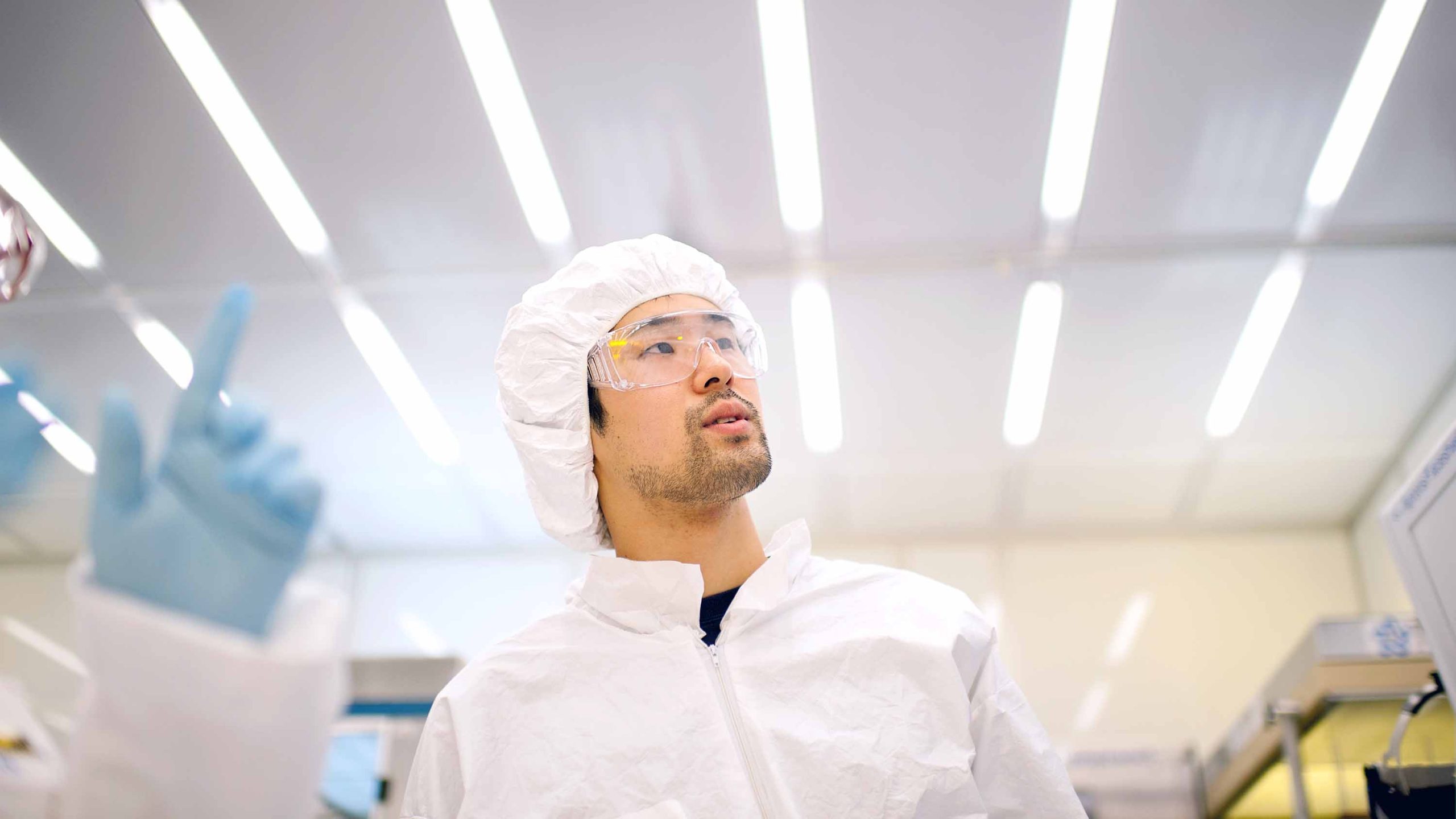 Student researcher in clean room
