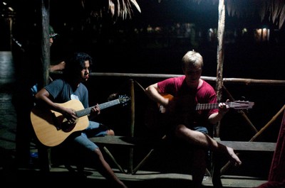 Guitar players in an impromptu nighttime concert