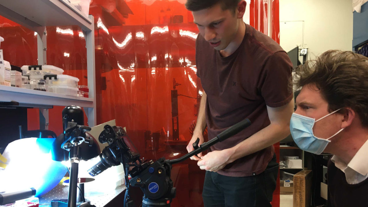 Joseph Toombs and Hayden Taylor film a 3D-printed glass sample on a rotation stage