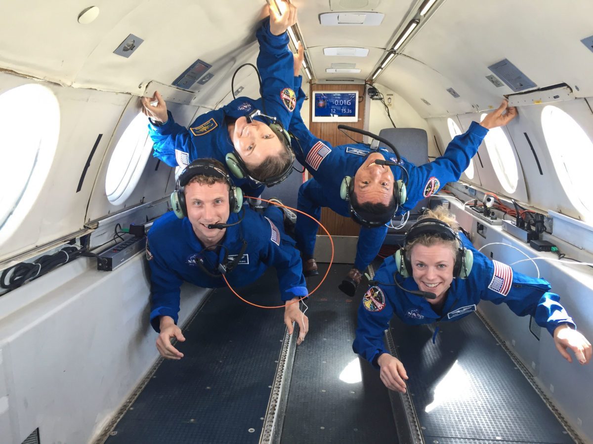 NASA astronaut candidates float during a reduced gravity airplane flight
