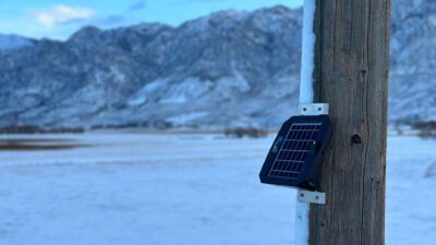Photo of Gridscope mounted to a power pole in a snowy, mountainous area. (Photo courtesy Gridware)