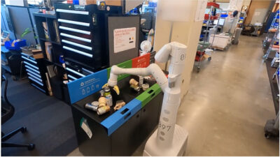 Photo of a robot sorting recyclables.