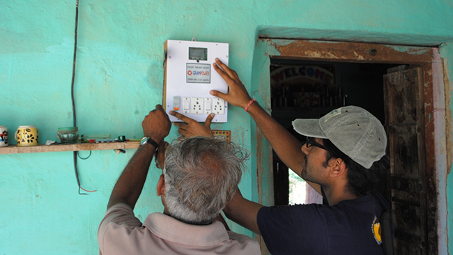 a student helping a community member with technology